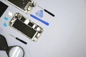 Tools for repairing smart phones on a white background - Change or replacement smart phones battery