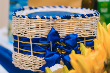 beautiful wicker box with blue hand made bows
