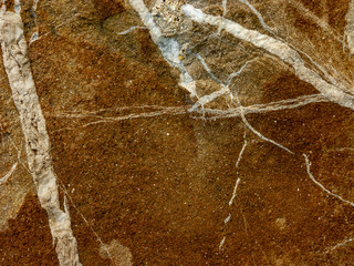Typical detail of an ancient Italian house wall, made of hand-carved river stones.