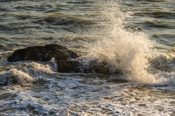 Splashing wave on the sea in morning