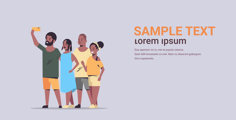 Obraz premium people group taking selfie photo on smartphone camera african american friends having fun male female cartoon characters full length flat gray background copy space horizontal
