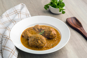 authentic chicken gravy served in a plate for lunch