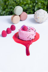 berry tart, macaroons and fresh berries on white table close-up.