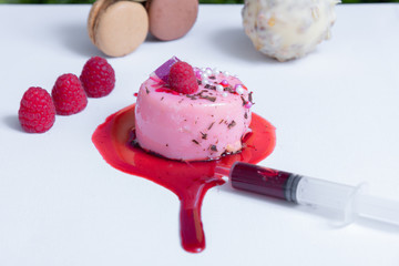 berry tart, macaroons and fresh berries on white table close-up.