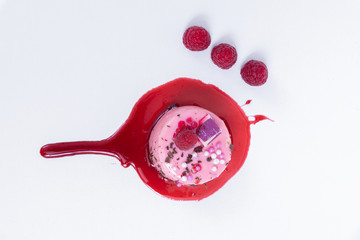 Top view of the pink cake. With wild berries and chocolate shavings
