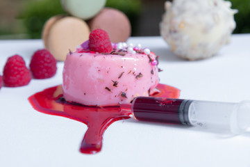 berry tart, macaroons and fresh berries on white table close-up.