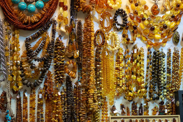 Background of amber necklaces and beads at the handicraft market