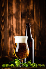 beer glass on dark wooden background
