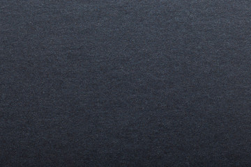 Texture of dark paper. Background for images. copyspace. space for text. sheet of gray craft paper as background. black paper