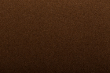 Texture of dark paper. Background for images. copyspace. space for text. sheet of gray craft paper as background. brown paper
