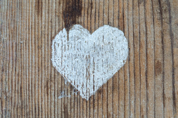 love and feelings, white heart on a wooden background