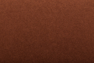 Texture of dark paper. Background for images. copyspace. space for text. sheet of gray craft paper as background. brown paper