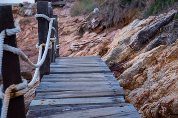 Wooden stairs along the rocks