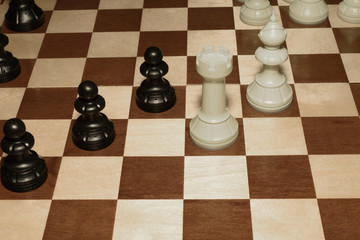 Wooden chess board and white pawns for skill theme