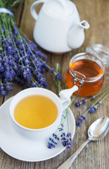 Cup of tea and honey with lavender flowers