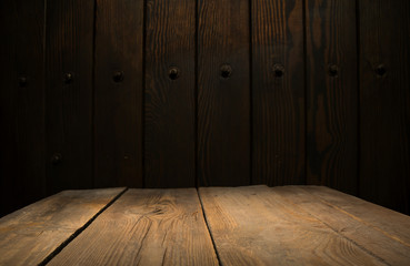 Selected focus empty brown wooden table and wall texture or old black brick wall blur background image. for your photomontage or product display