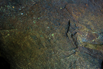 Background and black marble. Bedrock Stone In the forest near the waterfall
