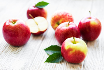 Fresh red apples on a old wooden table