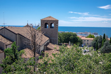 Trieste Cathedral next the Castello di San Giusto during touristic season.