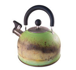 Kettle damaged by fire from a gas stove. Isolated on a white background