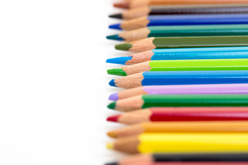 Colour pencils isolated on white background. Back to school concept Wood texture pencil with sharpening shavings on white background pencil on table, the blogger instrument. copyspace, space for text.