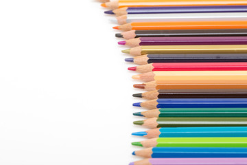 Colour pencils isolated on white background. Back to school concept Wood texture pencil with sharpening shavings on white background pencil on table, the blogger instrument. copyspace, space for text.