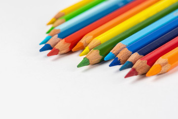 Set of colored pencils. Colors of rainbow. Colored pencils for drawing different colors on a white background.