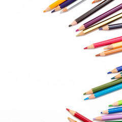 Colour pencils isolated on white background. Back to school concept Wood texture pencil with sharpening shavings on white background pencil on table, the blogger instrument. copyspace, space for text.