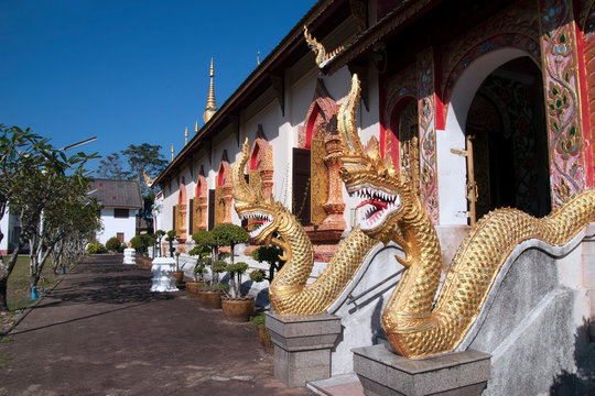Chiang Rai Thailand, naga's protecting side entrance to wat jed yod