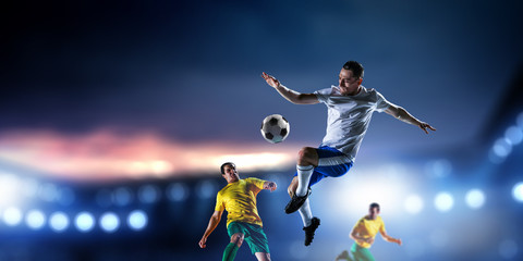 Soccer players on stadium in action. Mixed media