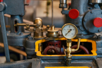 Vintage brass machinery with manometer.