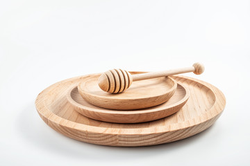 Fototapeta na wymiar Natural wind green wooden tableware elm wood dish plate wooden plate honey stick