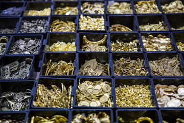 beads in different boxes. Material for handmade jewelery. Background for the store and the master. Shop for creativity. Fashionable craft of women.