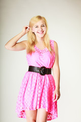 Lovely young girl wearing short pink dress