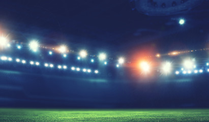 Night football arena in lights close up