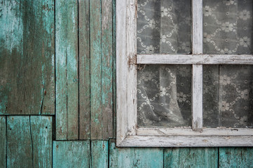 Old vintage barn wall with wooden window