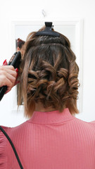 Fototapeta premium Female Hairstyles on curling in a beauty salon 