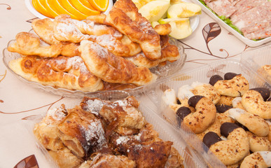 Delicious freshly baked bread on wooden background