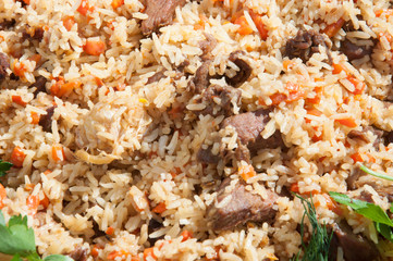 Uzbek pilaf in the market. Picnic with uzbek pilaf