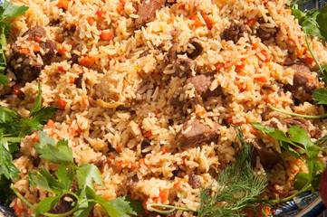 Uzbek pilaf in the market. Picnic with uzbek pilaf