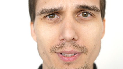 Obraz premium Face of young attractive talkative man on a white background