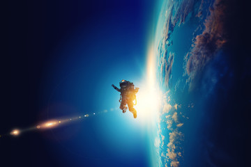 Spaceman and planet, human in space concept