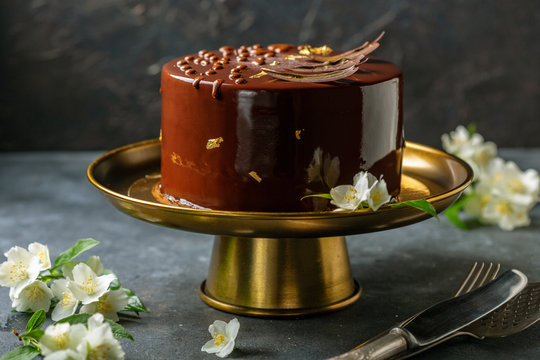 Modern mousse cake with chocolate decor.