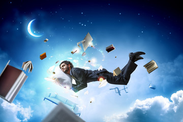 Joyful happe businessman levitating horizontally