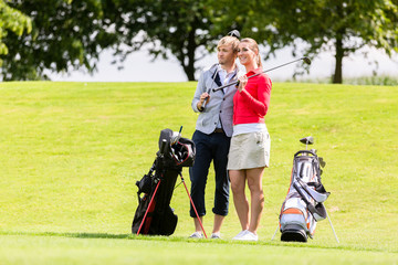 Portrait of golfing couple