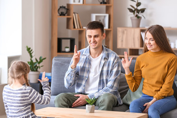 Deaf mute family using sign language at home