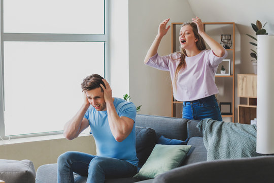 Young Quarrelling Couple At Home