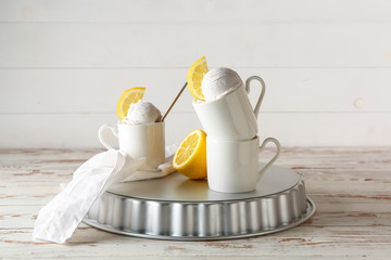 Cups with tasty ice cream on table