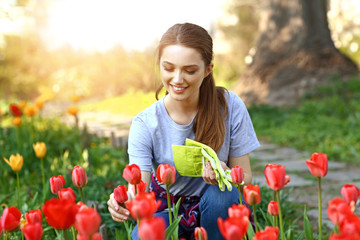Beautiful female gardener working outdoors