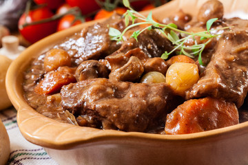 Beef Bourguignon stew served with baguette